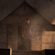Moon Knight (Oscar Isaac) stands in a darkened tomb.